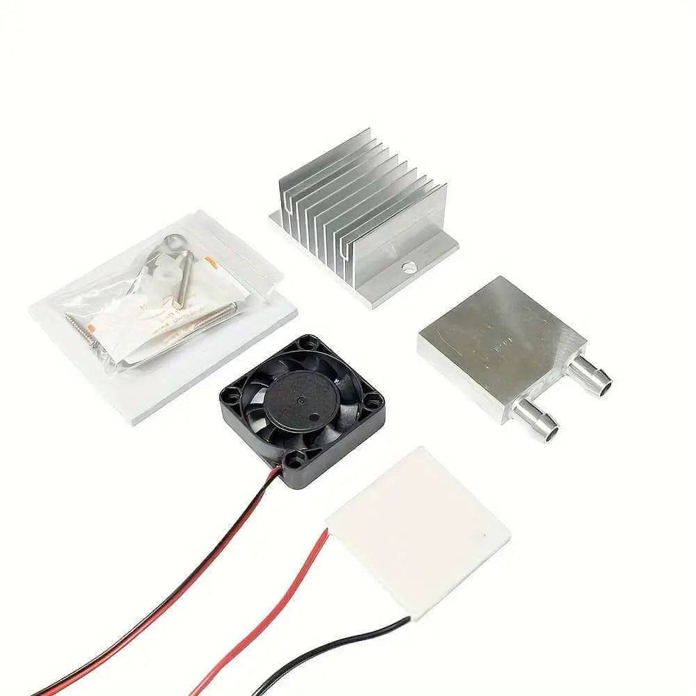 Parts of a 12V DC water cooling system kit including fan, heatsink, and TEC1-12706 Peltier module.