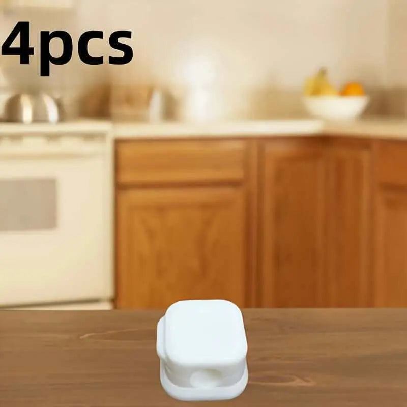 4-piece set of Magnetic Charging Cable Clips on a desk in a kitchen setting.