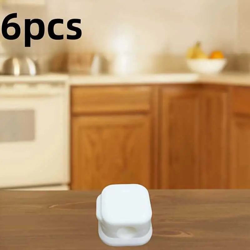 Magnetic charging cable clip organizer on a wooden table; 6 pieces set visible in kitchen background.