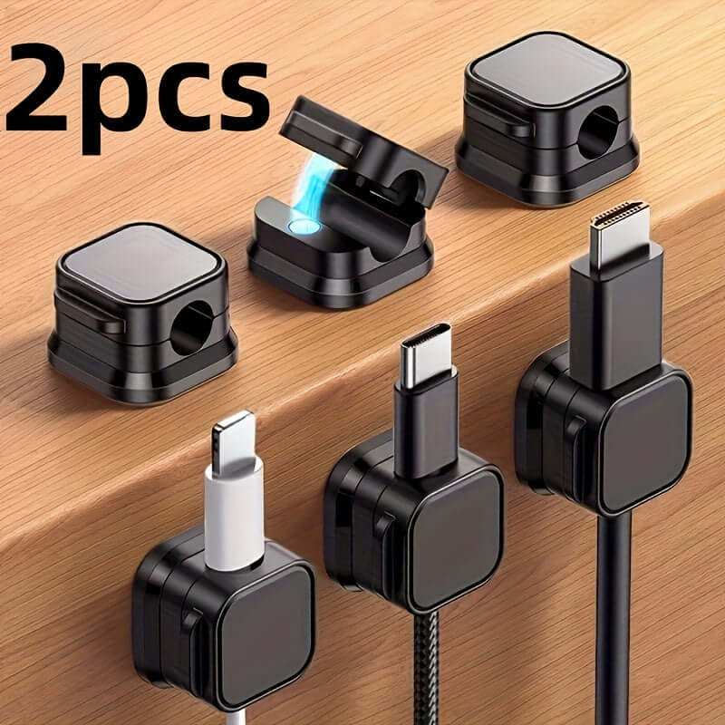 Magnetic charging cable clips organizing various device cables securely on a desk.