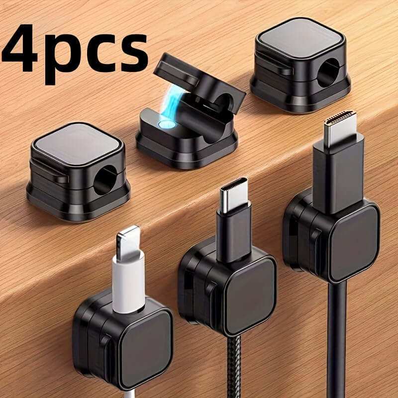 Magnetic charging cable clips organizing cords on wood surface.