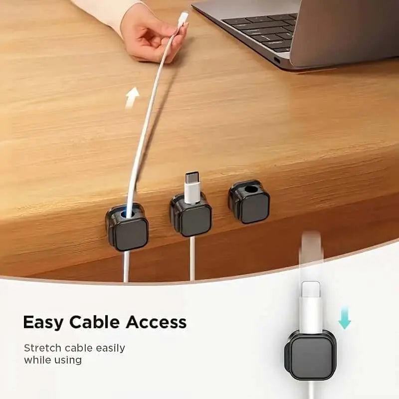 Magnetic charging cable clips organizing cables on desk for easy access.