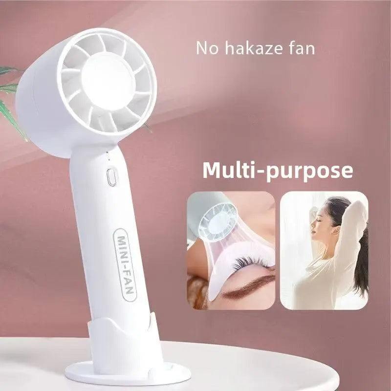 Portable mini fan with USB rechargeable feature and button control, suitable for indoor and outdoor cooling use.