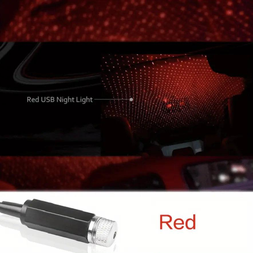 USB Star Projector Night Light illuminating a car interior with red starry sky effect.
