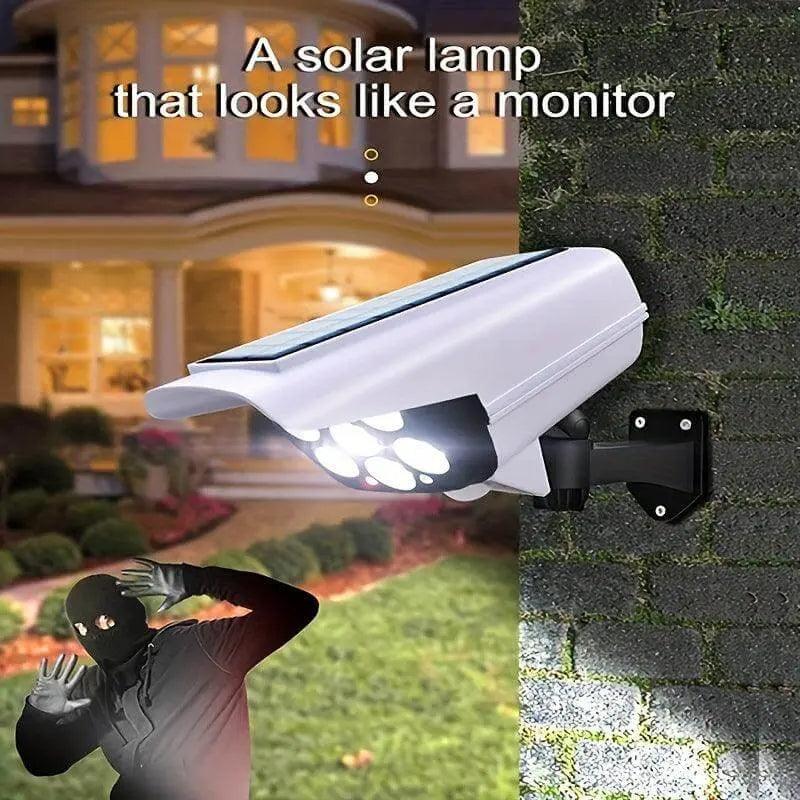 Solar-powered LED spotlight with motion sensor mounted on wall.