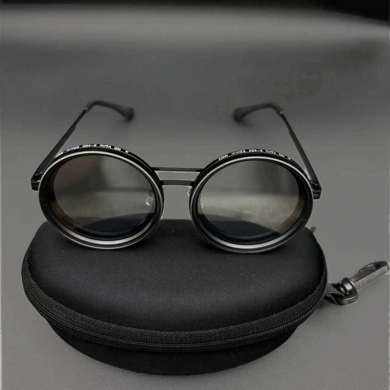 Aluminum frame glasses with polarized TAC lenses on black case.